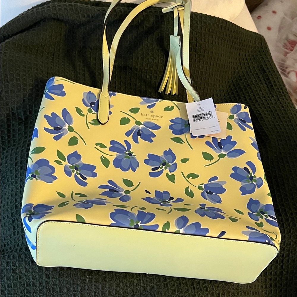 Kate Spade Yellow and Blue Floral Tote-never used
Two small dots on bottom